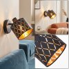 Applique moderna Alsen con paralume traforato nero e oro, orientabile, interruttore, E14