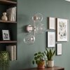 Moderna applique a 3 luci Koyoto con sfere in vetro chiaro trasparente